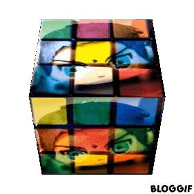 rotating rubiks cube with a small souichi kiruma plushie superposed